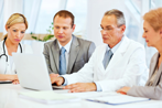 Physicians and Staff in Meeting